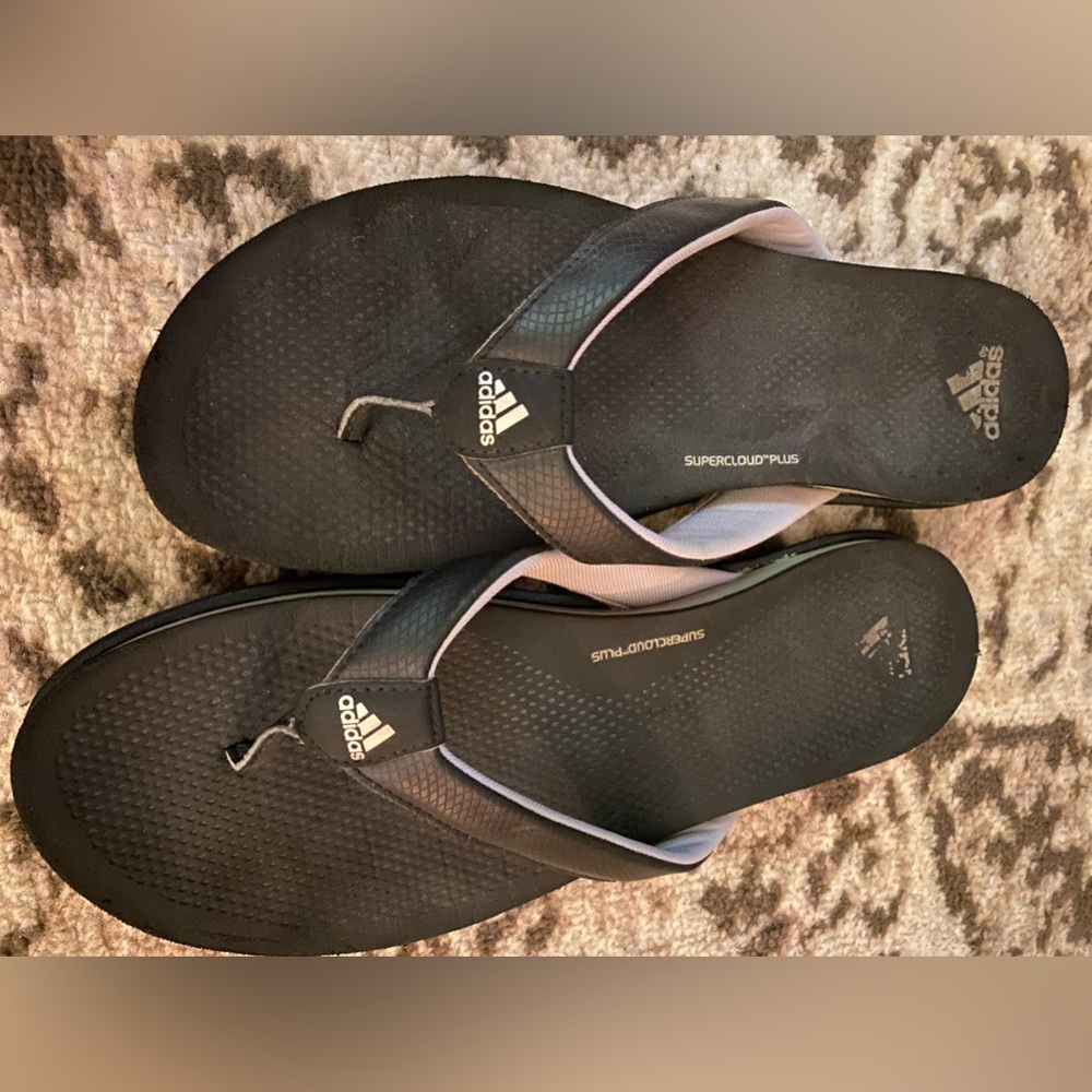 Used Adidas flip flops.